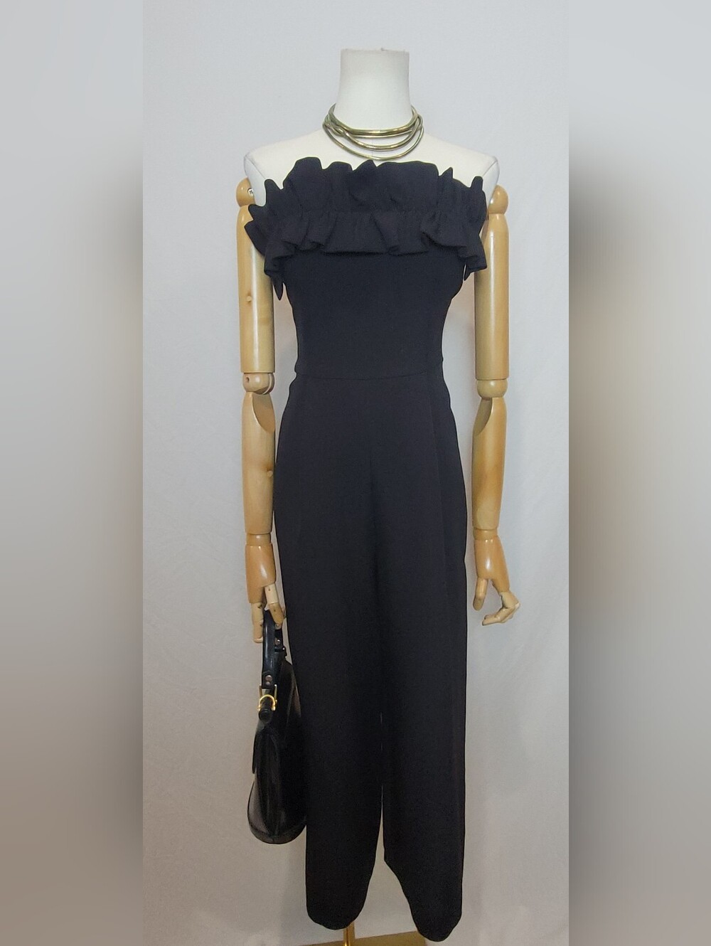Topshop jumpsuit features a distinctive off-the-shoulder neckline, Size 0
